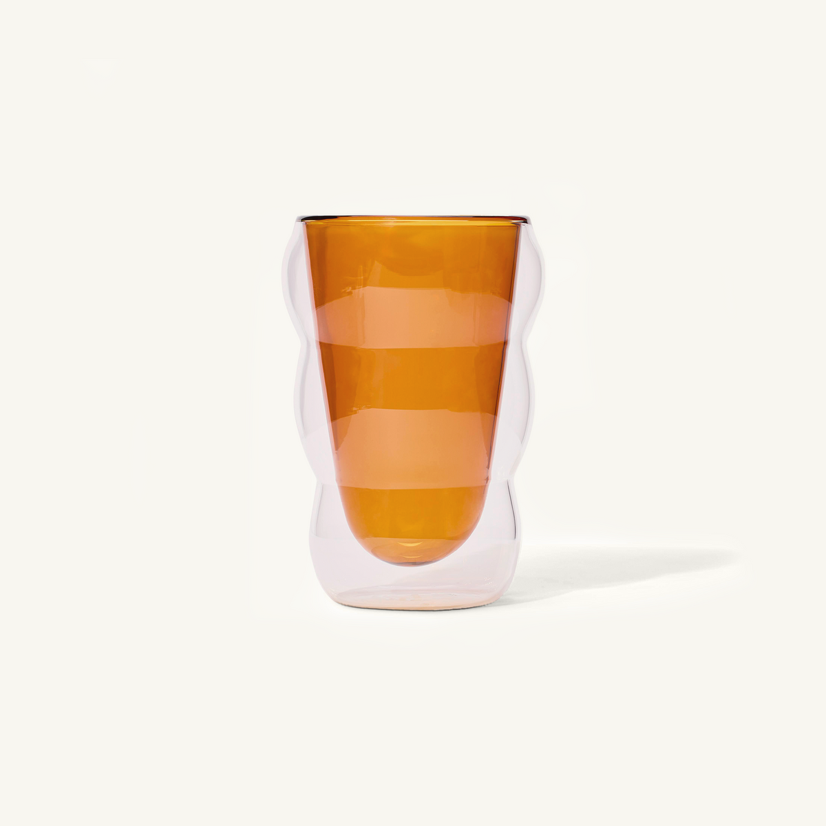 Double walled Amber Cloud Cup on an off white background.