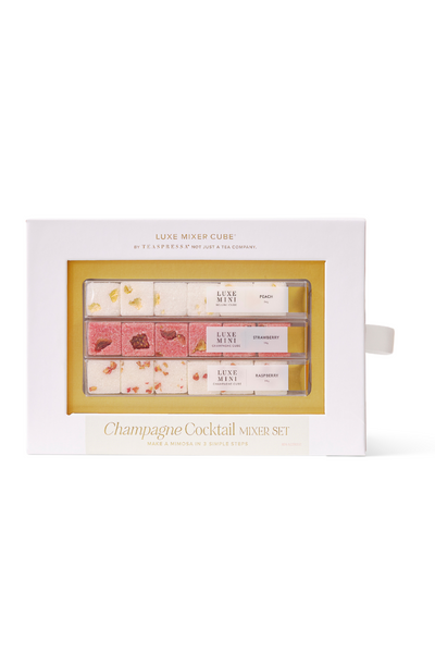 Set of champagne cocktail spoons in a decorative box on a white background