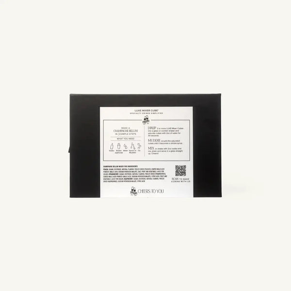 The back of a black rectangular box with a large white instruction label, photographed against a plain off-white background.
