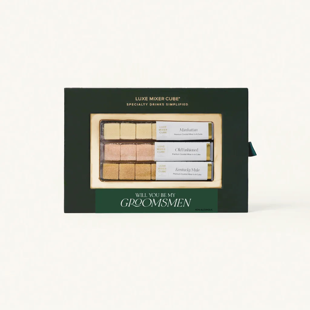 A green gift box containing Luxe Mixer Cubes for making specialty drinks, featuring three flavors: Manhattan, Old Fashioned and Kentucky Mule with a "Will you be my Groomsman" label.
