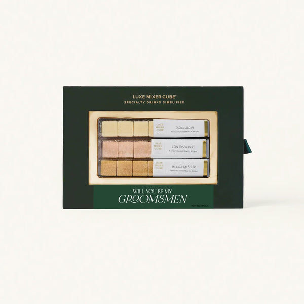 A green gift box containing Luxe Mixer Cubes for making specialty drinks, featuring three flavors: Manhattan, Old Fashioned and Kentucky Mule with a "Will you be my Groomsman" label.