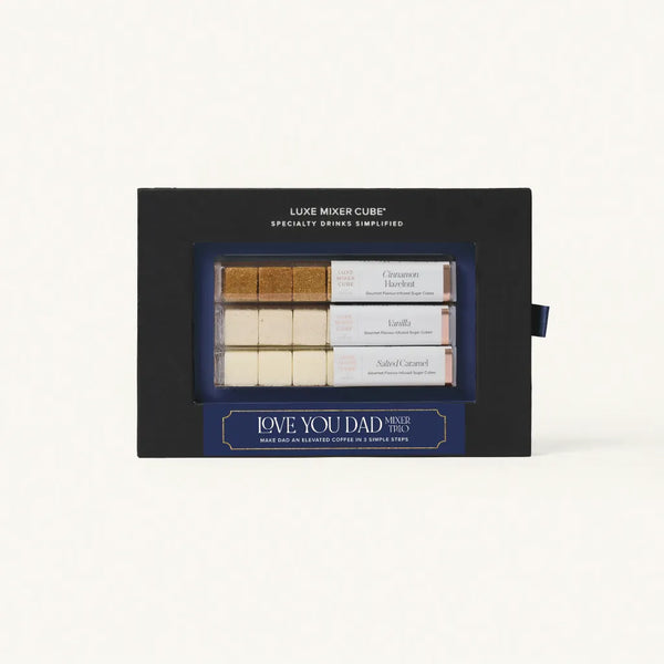Luxe Mixer Cube gift set with three small tubes and a black box on a white background
