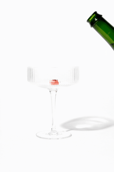 Set of champagne cocktail spoons in a decorative box on a white background