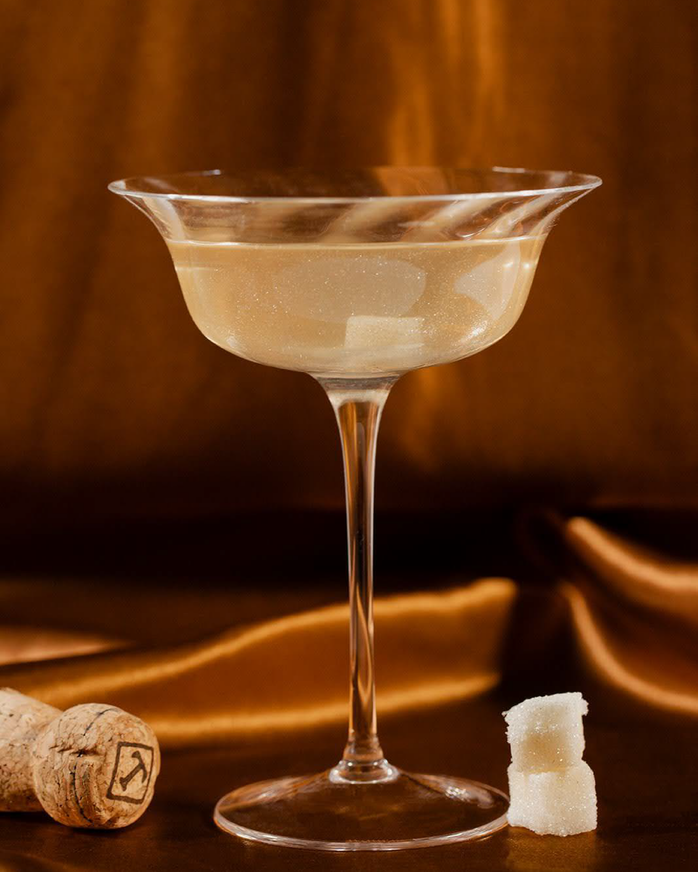 Teaspressa sugar cubes in champagne