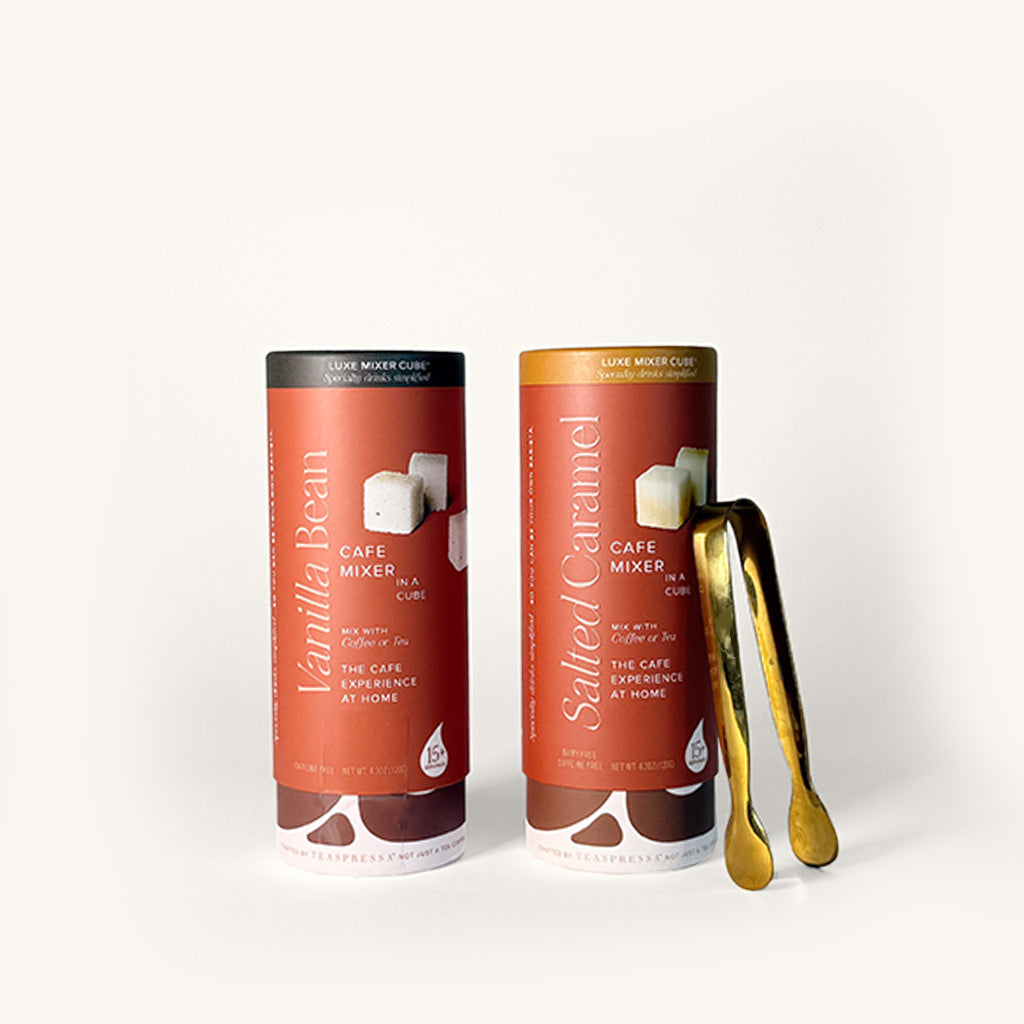 Two cylindrical coffee mixers with Vanilla Bean and Salted Caramel flavors on a white background.