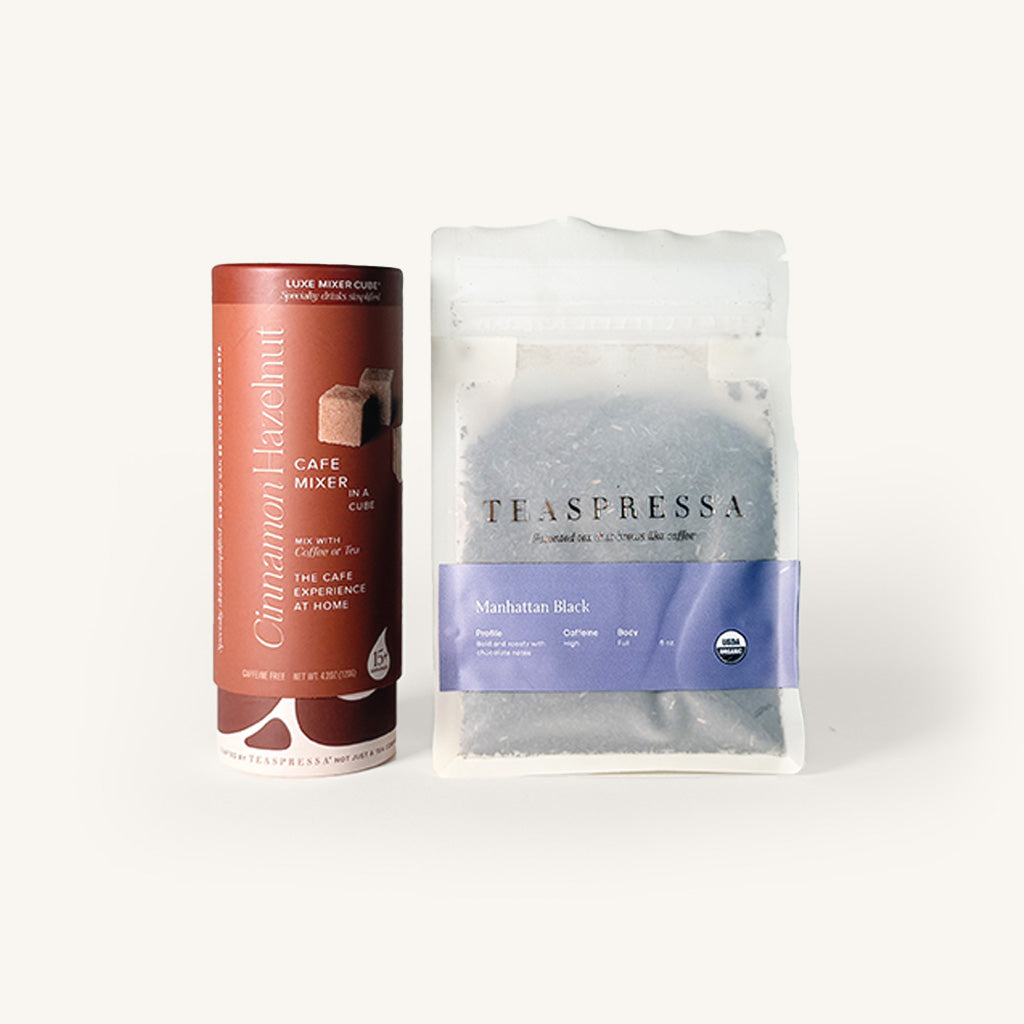 Cinnamon flavored coffee mixer and Teaspressa tea package on a white background