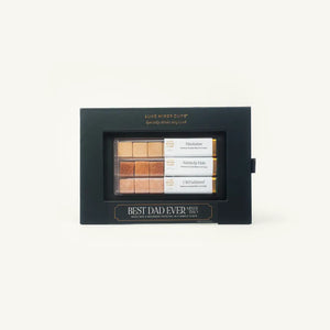 A black gift box labeled BEST DAD EVER displays a set of drink mixers and garnishes in various shades, with labeled sections for Manhattan, Kentucky Mule, and Old Fashioned recipes.