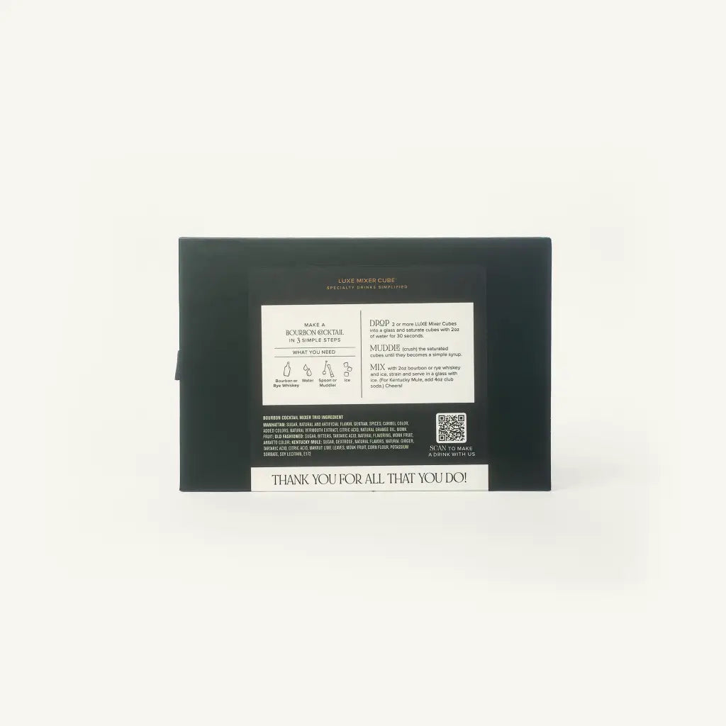 The back of a black rectangular box with printed white text and a small QR code, photographed against a plain white background.