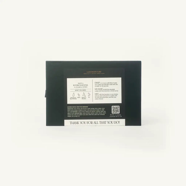 The back of a black rectangular box with printed white text and a small QR code, photographed against a plain white background.