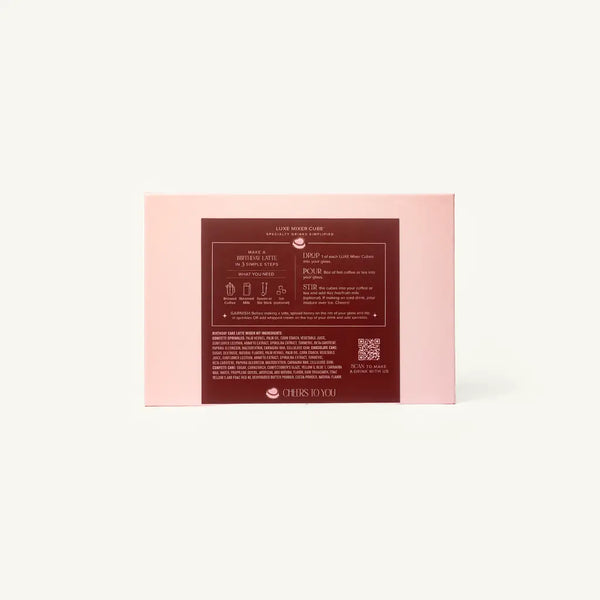The back of a light pink rectangular product box with a dark red central label containing text and a QR code, photographed on a clean off-white background.