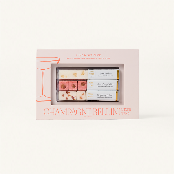 Packaged set of Champagne Bellini mixer cubes with a pink box on a white background