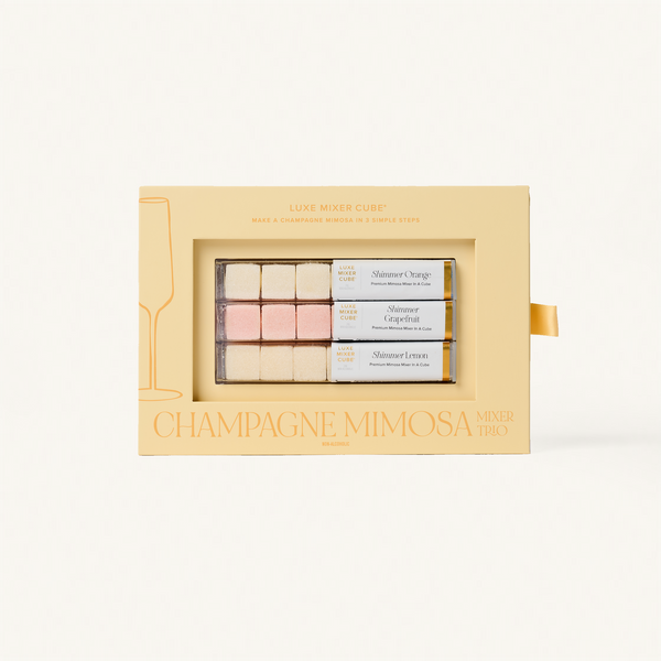 Champagne Mimosa mini gift set in a decorative box on a white background