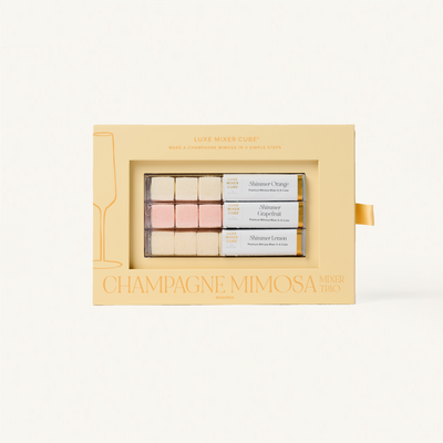 Champagne Mimosa mini gift set in a decorative box on a white background