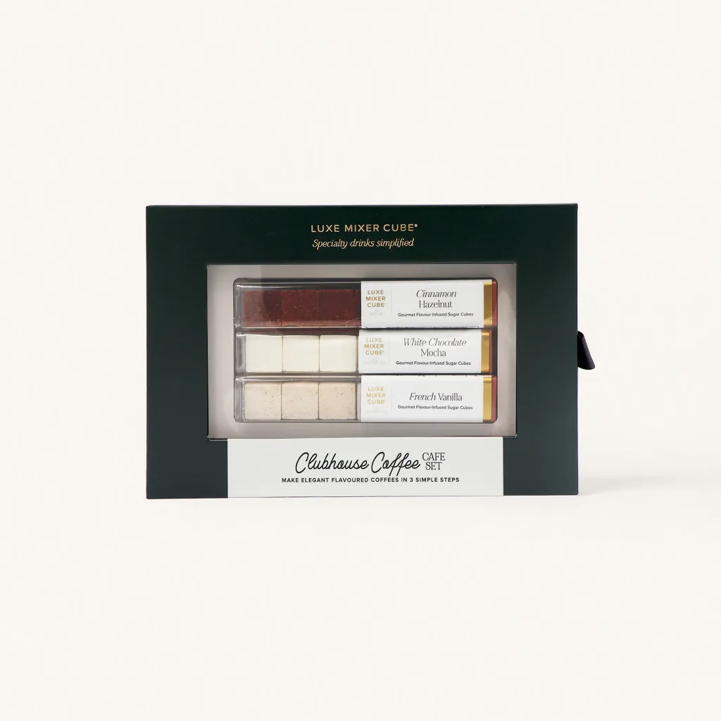 A boxed set labeled Clubhouse Coffee Café Set containing flavored drink cubes in three varieties: Cinnamon Brown Sugar, White Chocolate Mocha, and French Vanilla, displayed in a green and cream package.
