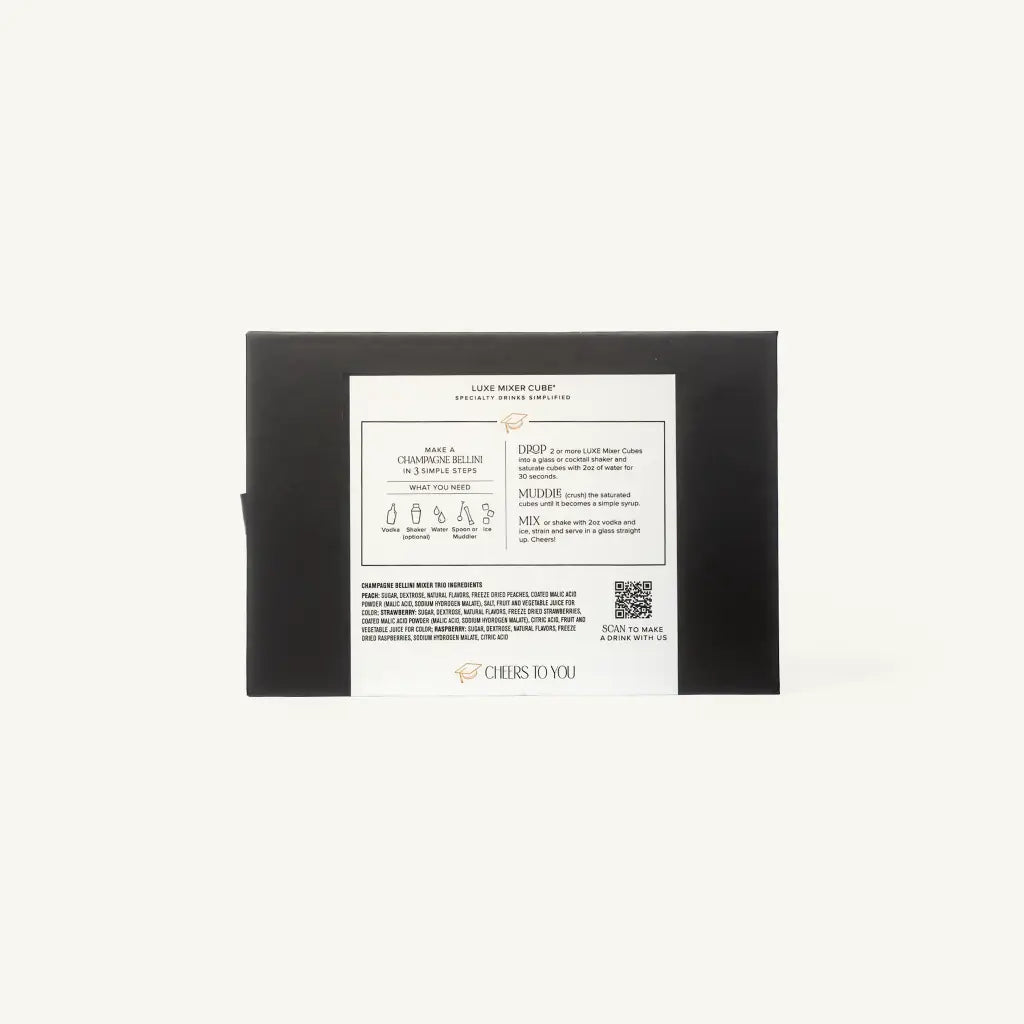 The back of a black rectangular box with a large white instruction label, photographed against a plain off-white background. The label includes product information, dropper illustrations, and the brand name CHEERS TO YOU.