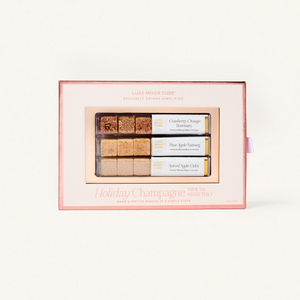 Set of holiday-themed soap bars in a decorative box on a white background