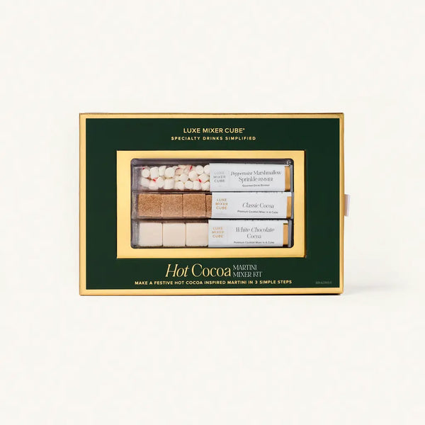 Hot cocoa mix set in a green and gold box with 'Luxe Mixer Cube' branding.