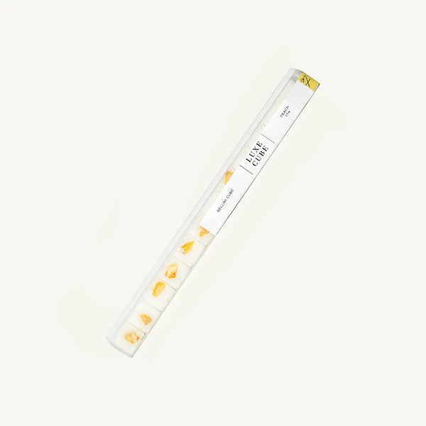 A clear packaging containing luxury cube sugar with a design featuring gold and white colors.