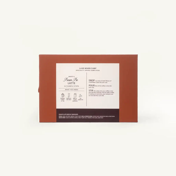 A rectangular brown cardboard box with a white instruction label on the front, photographed against a plain off-white background. The label includes text and small diagrams for making a latte and dropping espresso.