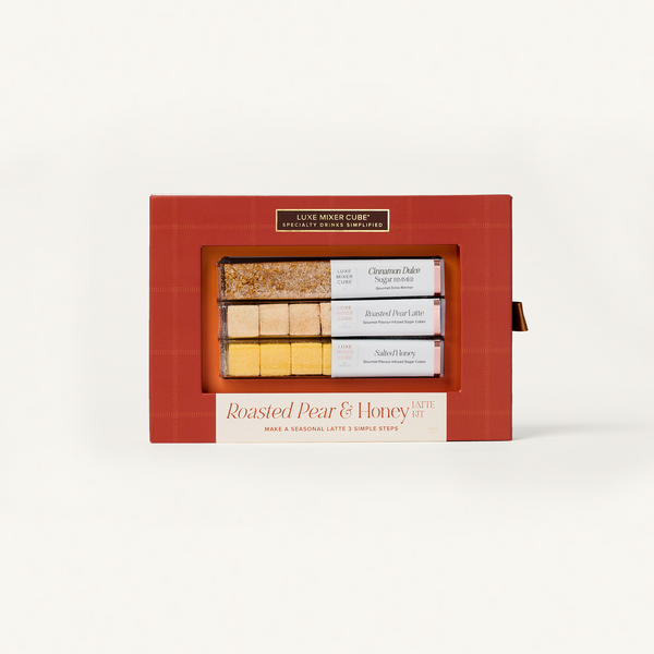 Red gift box with 'Luxe Mixer Cube' branding containing roasted pear and honey treats.