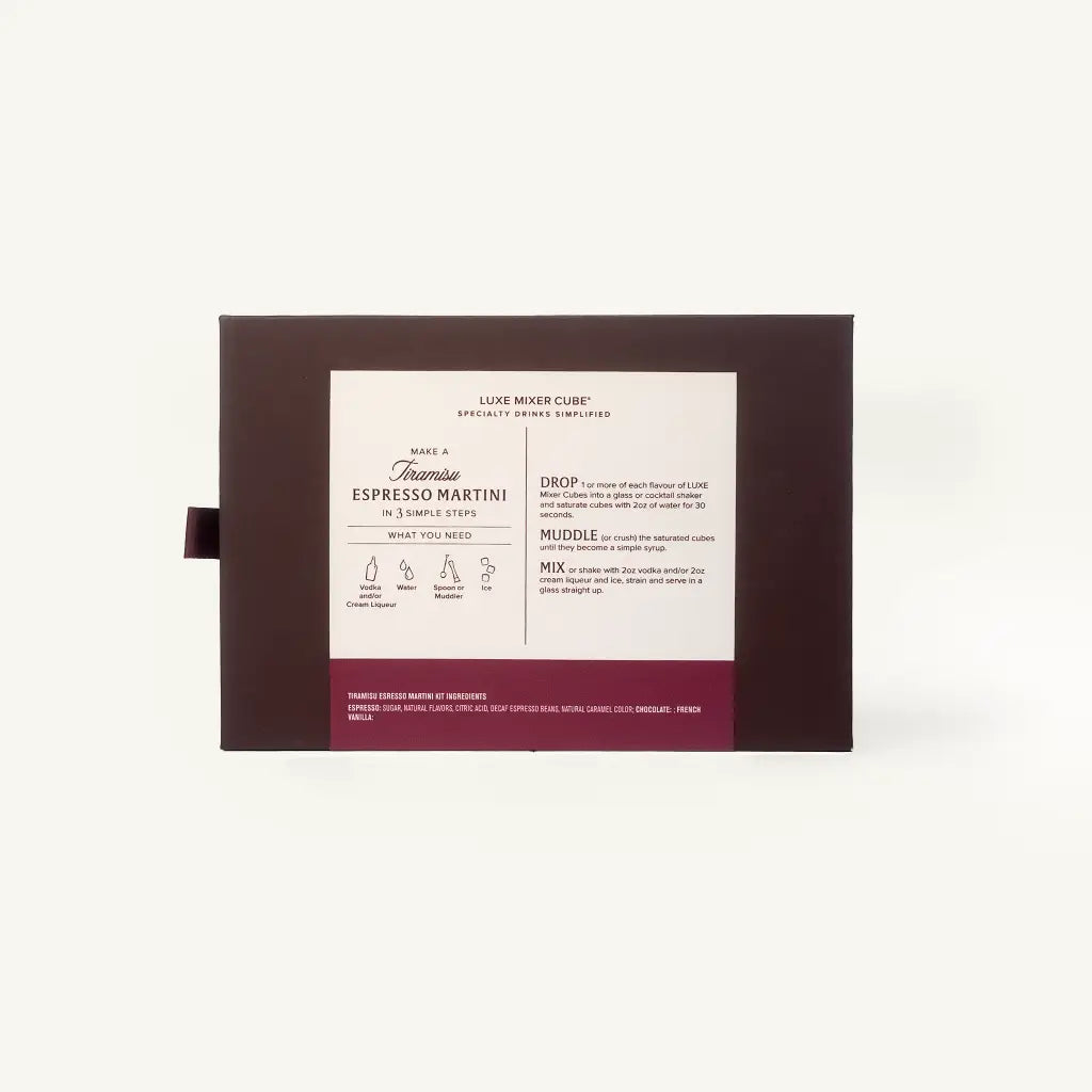 A boxed beverage product shown against a plain light background. The package is dark brown with a large white front label and a burgundy band at the bottom.