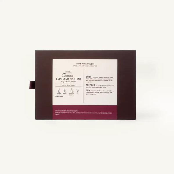 A boxed beverage product shown against a plain light background. The package is dark brown with a large white front label and a burgundy band at the bottom.