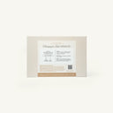 Rectangular beige box with a white label reading Champagne Toast Mixer Kit. Instructions and a QR code are visible under the label, with a gold band at the bottom that says Cheers to love, laughter, & happily ever after.